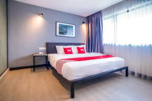 Postel nebo postele na pokoji v ubytování OYO 89576 Mokka Hotel