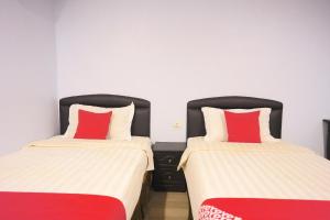 Postel nebo postele na pokoji v ubytování Super OYO 89544 Utama Inn