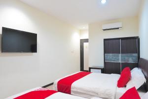 Postel nebo postele na pokoji v ubytování Super OYO 89544 Utama Inn