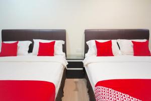 Postel nebo postele na pokoji v ubytování Super OYO 89544 Utama Inn