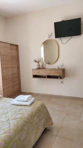 Postel nebo postele na pokoji v ubytování Sea Breeze Apartments