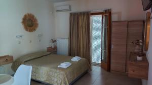 Postel nebo postele na pokoji v ubytování Sea Breeze Apartments