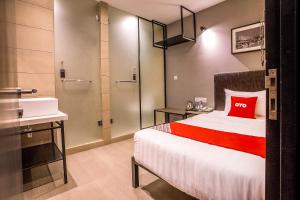 Postel nebo postele na pokoji v ubytování OYO 89576 Mokka Hotel