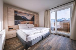 Voodi või voodid majutusasutuse Hotel Lainbach in Wängle toas