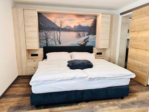Voodi või voodid majutusasutuse Hotel Lainbach in Wängle toas