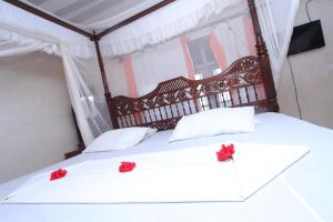 Ένα ή περισσότερα κρεβάτια σε δωμάτιο στο Jannataan Hotel