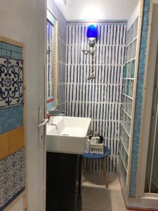 a bathroom with a white sink and a mirror at I Colori nel Castello Capranica in Capranica +26 photos