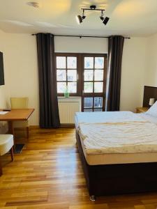 Postel nebo postele na pokoji v ubytování Landhaus Magnus
