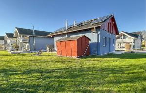 a smallshed in a yard in a field of houses at Seebrise in Süssau +14 photos