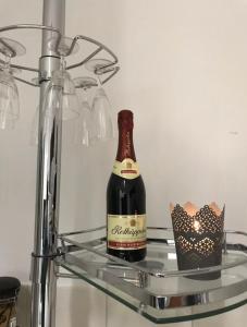 a bottle of wine sitting on a shelf in a refrigerator at Ihre Ferienwohnung in Goddelsheim +13 photos