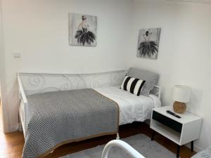 Ένα ή περισσότερα κρεβάτια σε δωμάτιο στο Apartamento Deluxe II RB