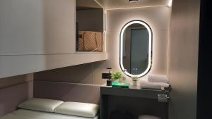 a bathroom with a sink and a mirror on an airplane at Hostel Superlativo Trinidad in Málaga +79 photos