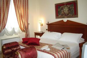 Postel nebo postele na pokoji v ubytování D'Angelo Palace Hotel