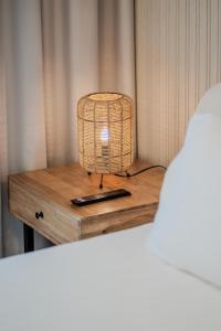 a bird cage sitting on top of a wooden table at The AlJada Studio by Blue Cloud Holidays in Sharjah