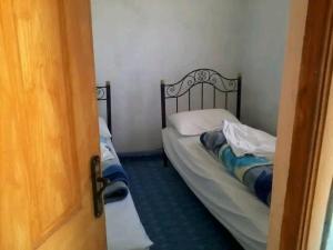 Postel nebo postele na pokoji v ubytování Gîte du lac chez bennouri