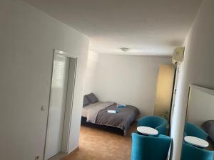 Postel nebo postele na pokoji v ubytování Apartmány Júlia