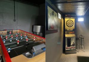 a room with a pool table and a dart board at Suite avec jacuzzi idéale pour visiter la Normandie in Saint-Jean-du-Cardonnay