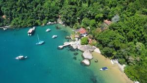an aerial view of a beach with boats in the water at Casa Centro Historico in Paraty