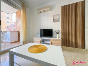 TV a/nebo společenská místnost v ubytování Ubicación ideal, relax y piscina