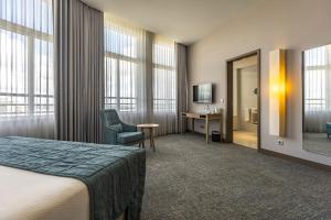 TV a/nebo společenská místnost v ubytování Montebelo Girassol Maputo Hotel