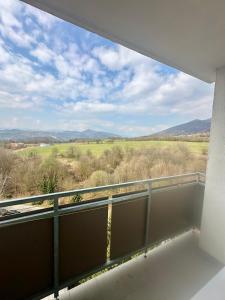 a balcony with a view of a field at Pieninská apartment in Banská Bystrica