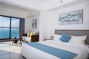 Voodi või voodid majutusasutuse Huizhou Xunliao Bay Qingpu Hotel toas