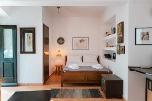 a bedroom with a bed in a room at Infinity I - Stylish Apartment with Views in Lagoúdi Zía