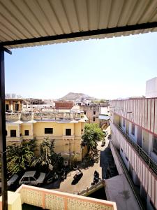 a view of a city from a balcony at Nav Durga Homestay in Udaipur