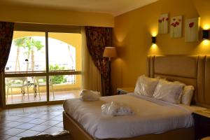 Postel nebo postele na pokoji v ubytování Royal Regency Club - Ultra All Inclusive