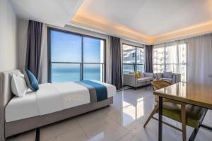Voodi või voodid majutusasutuse Huizhou Xunliao Bay Qingpu Hotel toas