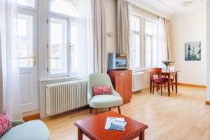 Televízia a/alebo spoločenská miestnosť v ubytovaní Hapimag Apartments Prague