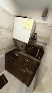 a kitchen with a sink and a counter top at Royal castle in Zirakpur