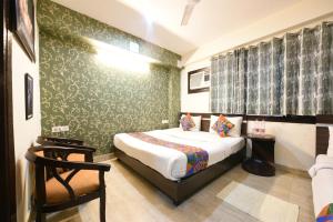 Postel nebo postele na pokoji v ubytování Hotel Classic Plaza At Delhi Airport