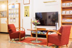 Televízia a/alebo spoločenská miestnosť v ubytovaní Hapimag Apartments Prague