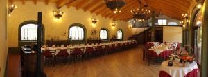 a large room with tables and chairs in a building at Agriturismo Greppi in Crescentino