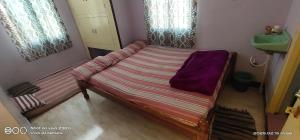 Postel nebo postele na pokoji v ubytování Shree chendur Residency ROOMS