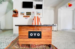 a wooden table with the oo sign on it in a room at Best Guest house in Varanasi +7 photos