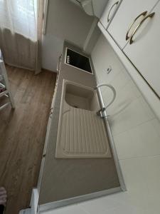 an open door of a refrigerator in a kitchen at Da Iro in Larisa
