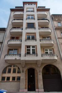 a tall building with a balcony on top of it at A96 in Budapest