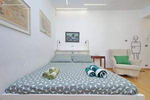 Una cama o camas en una habitación de Delizioso loft all'Esquilino