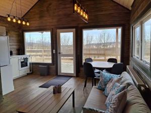 a living room with a couch and a table at Country cottage in Þingeyjarsveit