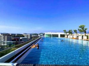 a swimming pool on the roof of a building at Ea gathering homestay in Kota Kinabalu