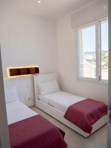 Postel nebo postele na pokoji v ubytování Villa Cordella 33