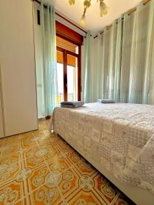 A bed or beds in a room at Casa Vacanze Breva