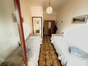 A bed or beds in a room at Casa Vacanze Breva