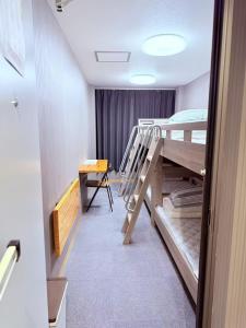 Postel nebo postele na pokoji v ubytování HOSTEL s