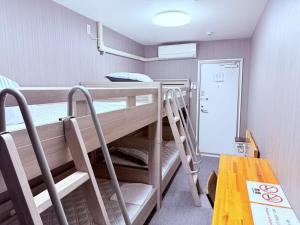 Postel nebo postele na pokoji v ubytování HOSTEL s
