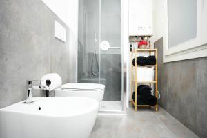 a bathroom with a sink and a toilet and a shower at Ca' San Marco - Residenza di Lusso a Due Passi dalla Basilica in Vicenza +26 photos