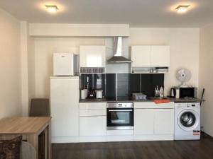 A kitchen or kitchenette at Ádám Guesthouse I.