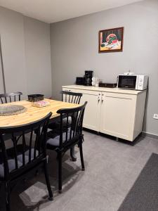 a kitchen with a table and chairs and a microwave at Modern Furnished Historical Building in Istanbul
